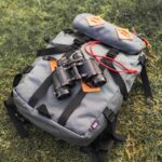 An image showing a solar-powered backpack with a binocular.