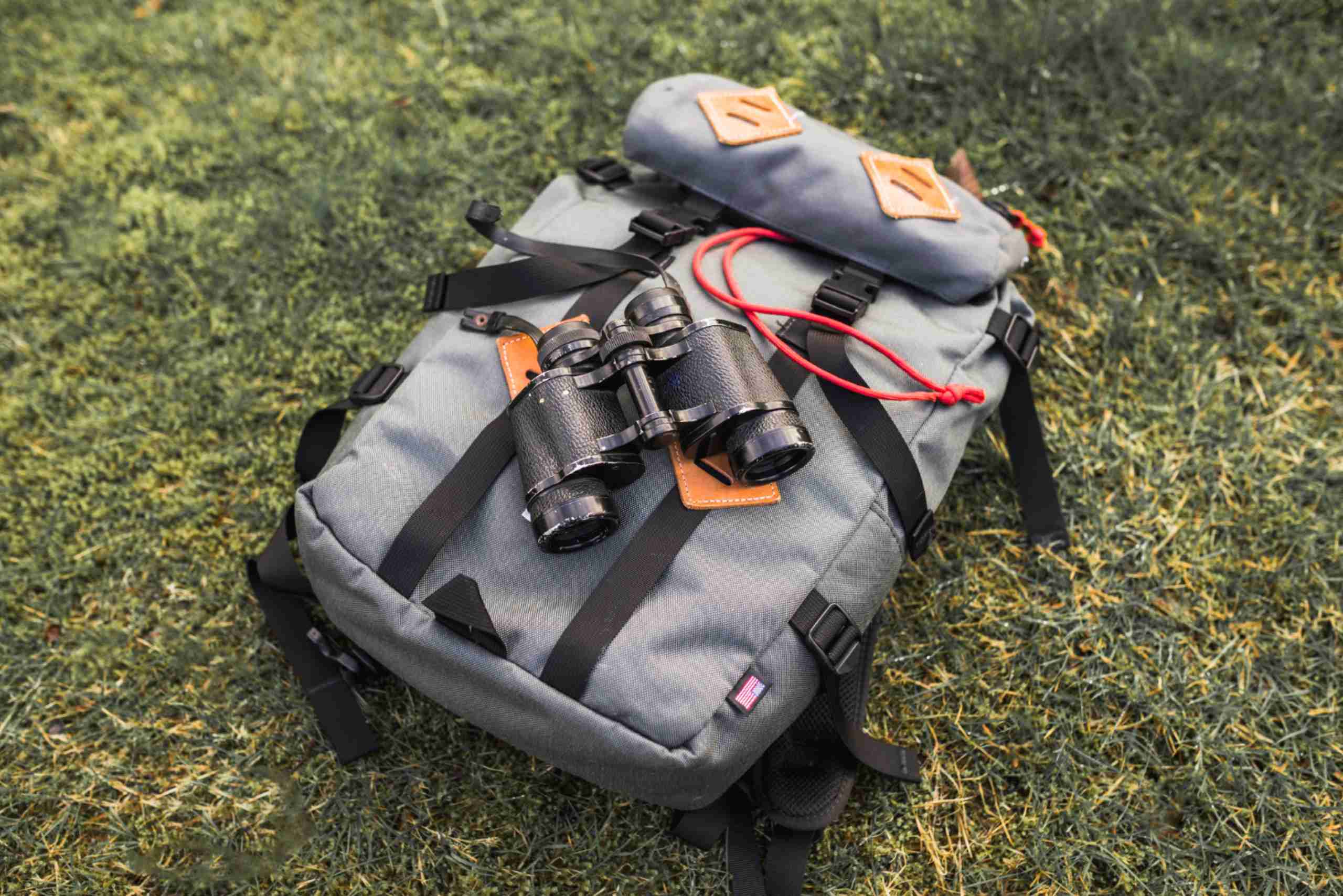 An image showing a solar-powered backpack with a binocular.
