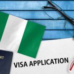 An image showing a visa application form and the Nigerian flag depicting Nigerian visa application.