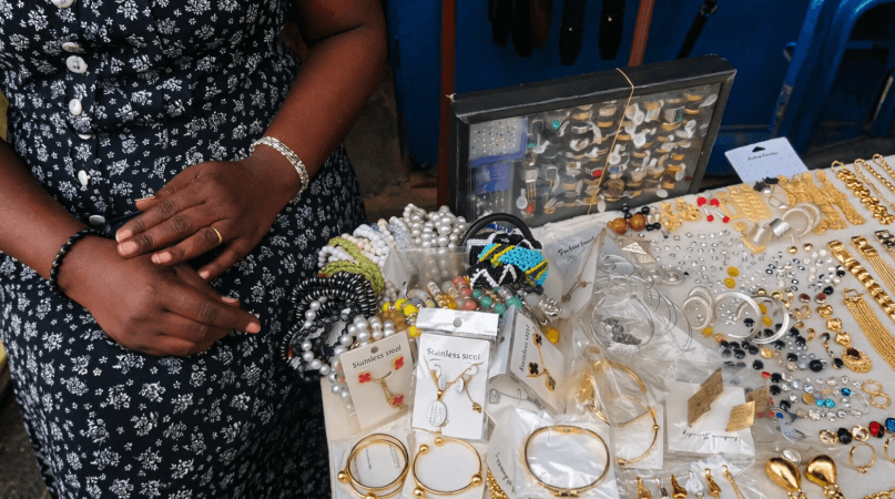 Beaded bracelets, pearls and stainless steel jewellery at a Kimironko Market stall, Kigali – souvenir prices on a Kigali travel budget