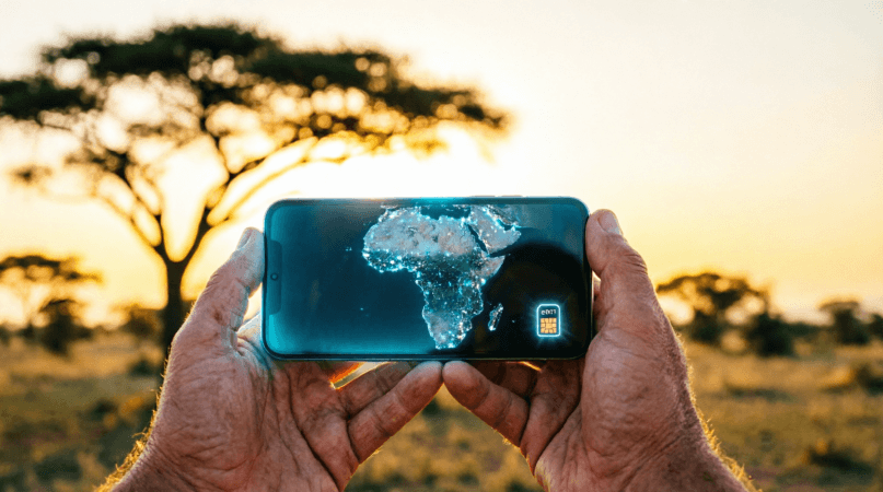 Traveler holding smartphone with digital Africa map and eSIM icon with African savanna background