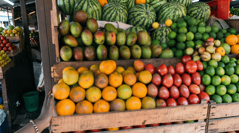 Fresh mangoes, oranges, watermelons and limes at Kimironko Market, Kigali – real Kigali prices on a $10 kigali travel budget